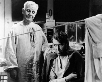 One man looking at another from behind