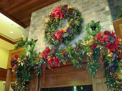 A wreath and garland over a fireplace.