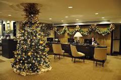 A decorated christmas tree in a commercial lobby