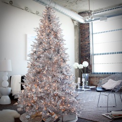 A christmas tree with white decorations