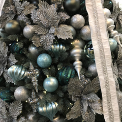 A close up of silver and green christmas decorations