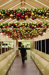 Christmas ornaments above a walkway